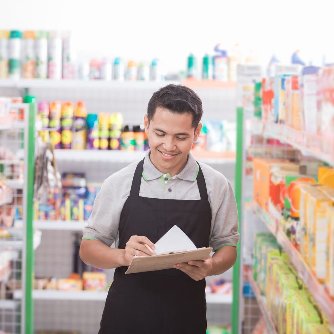 Thai retail shop owner managing stock with Vansales